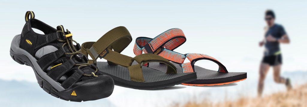 A man wearing hiking sandals walks in the background.